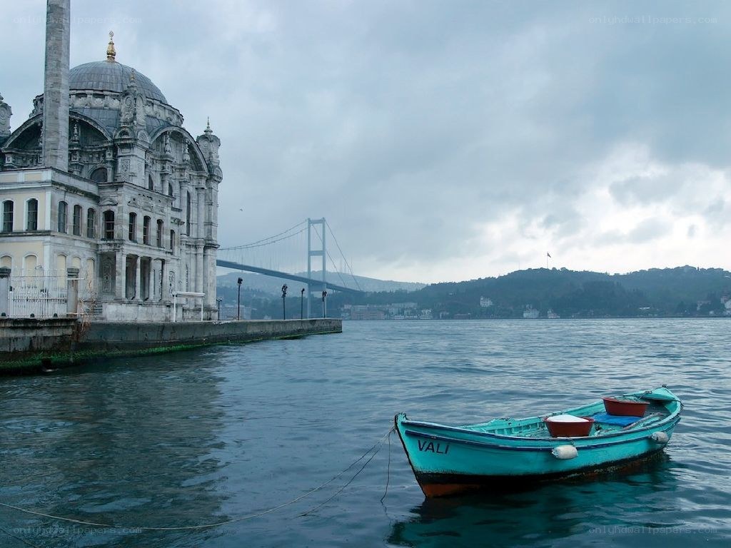 Boat near palace with bridge