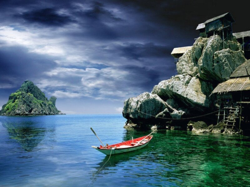Boat near rocky island
