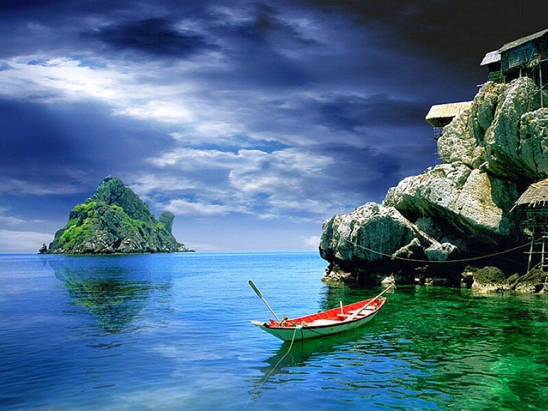 Boat near rocky island