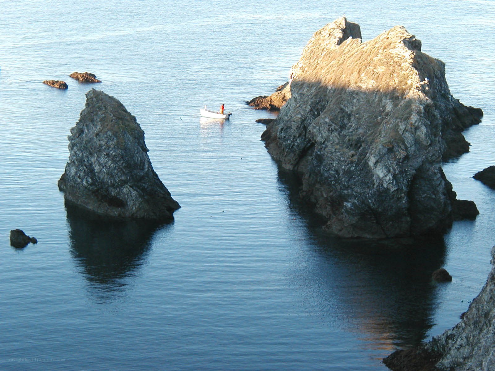 Boat near rocky islets
