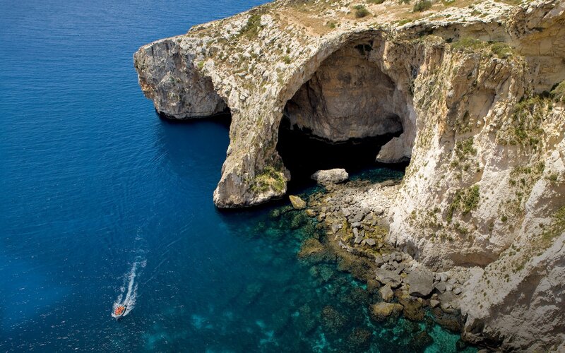 Boat Near Sea Cave
