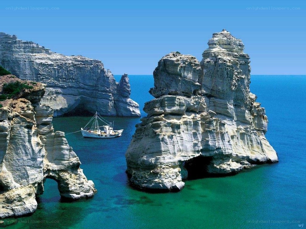 boat near sea cliffs