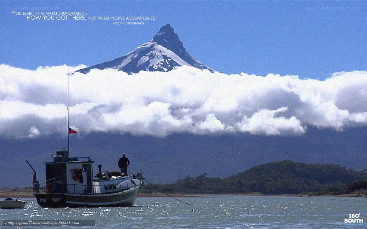 Boat near snow-capped mountain