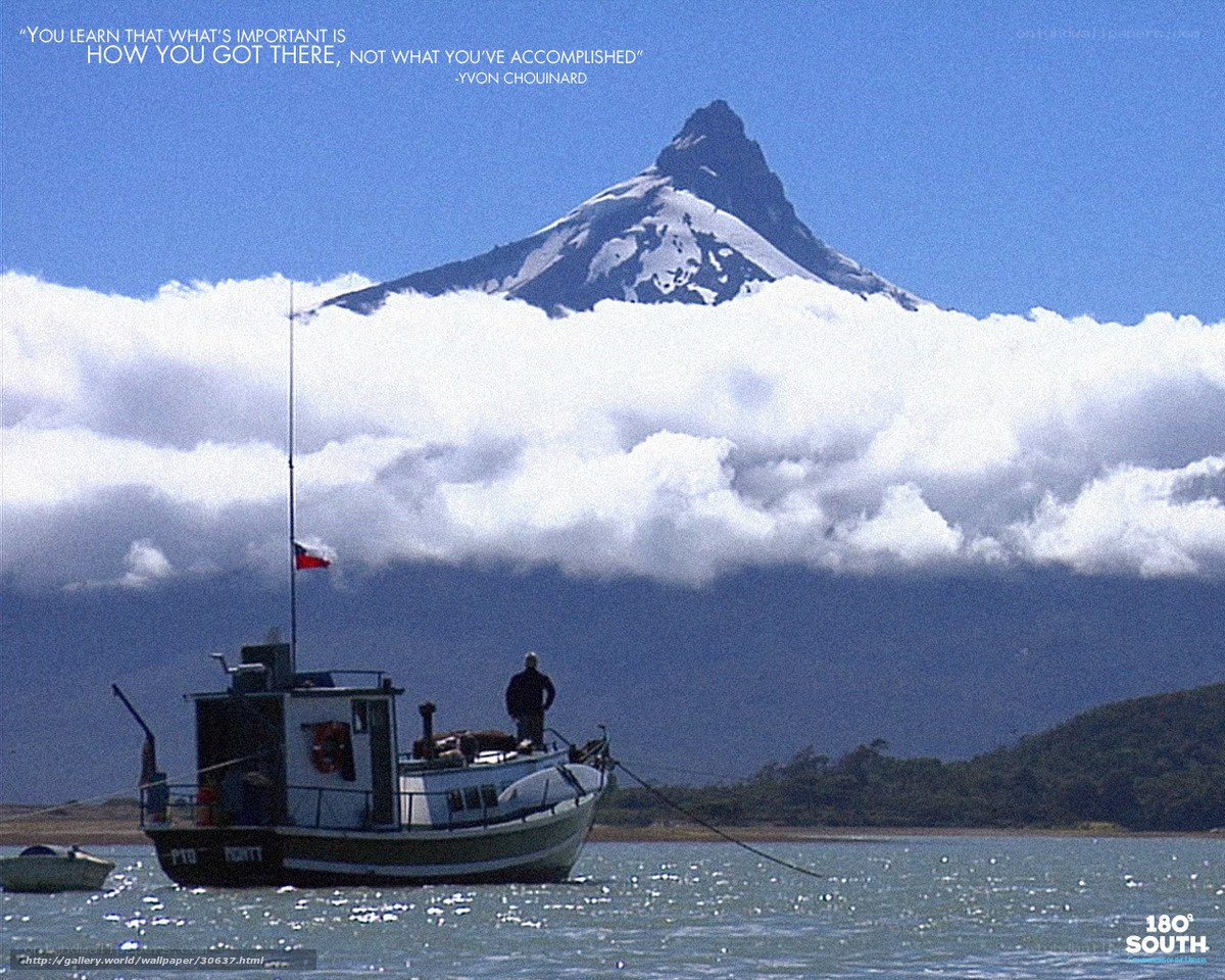 Boat near snow-capped mountain