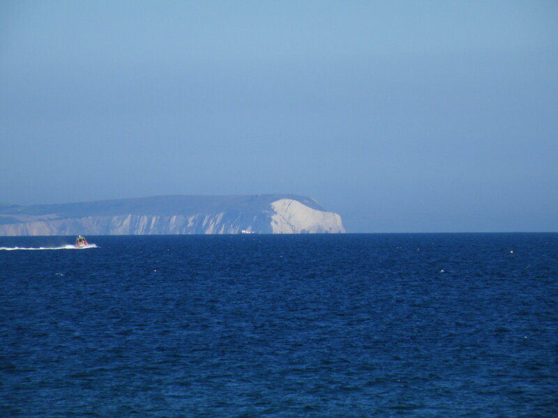 Boat near white cliffs