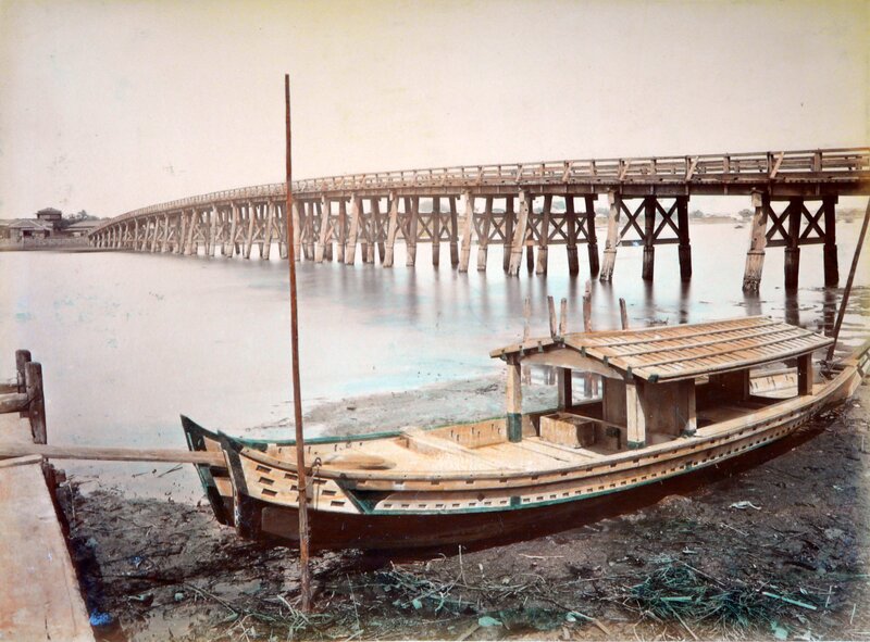Boat near wooden bridge