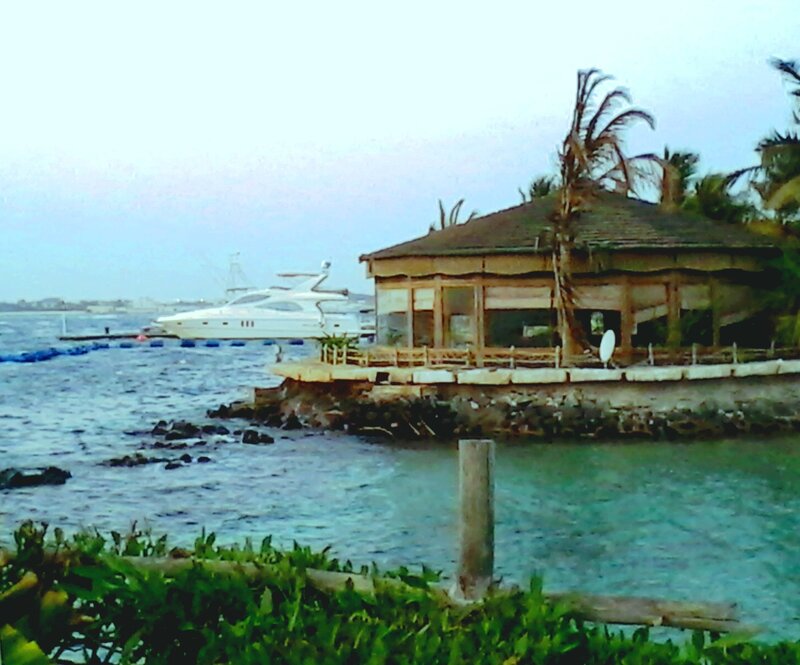 Boat Near Wooden Hut