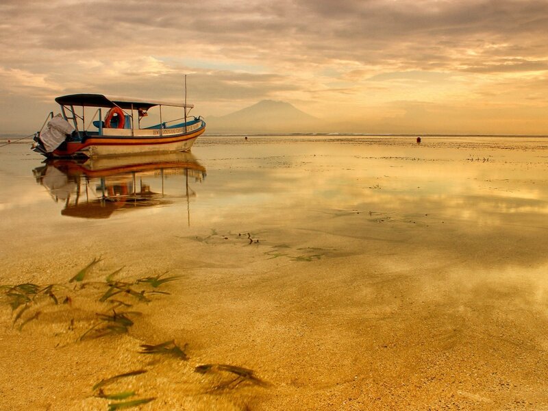 Boat on a beach at sunset