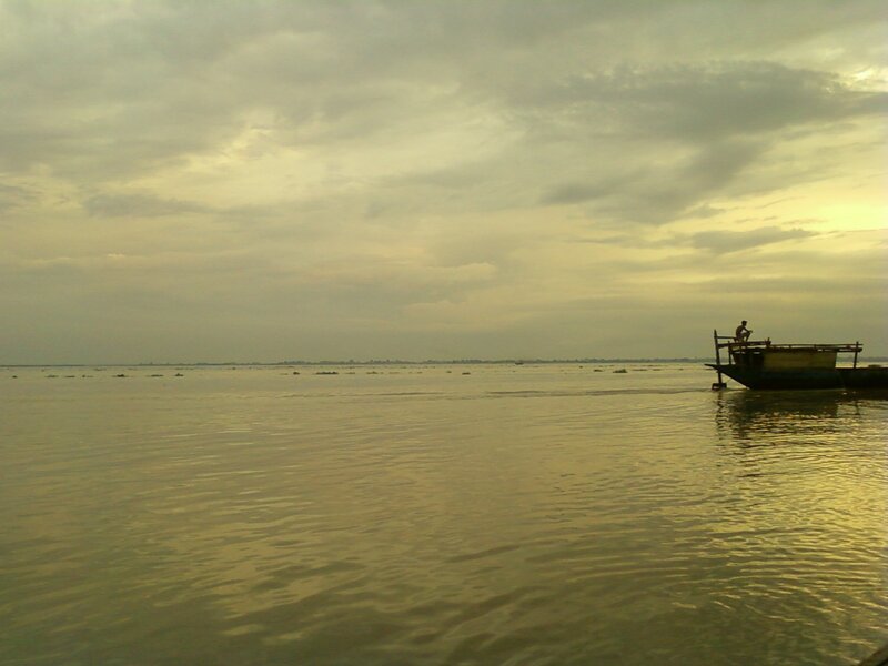 Boat on a calm lake at dusk