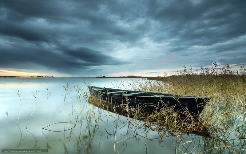 Boat on a calm lake at dusk