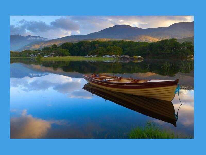 Boat on a calm lake at sunset