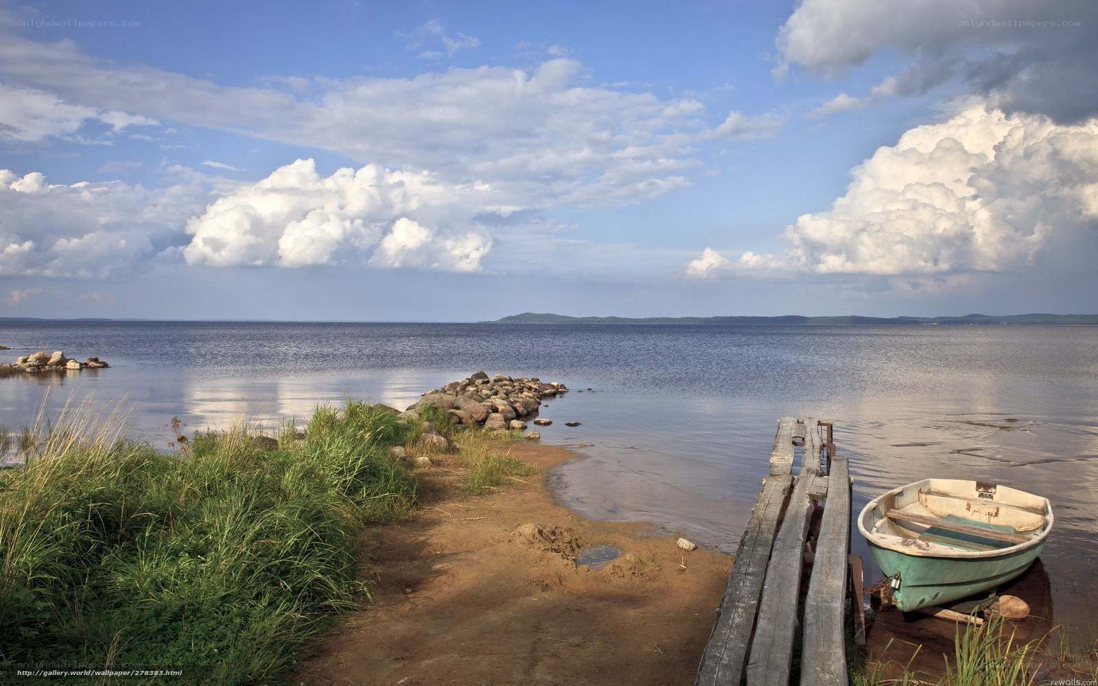 Boat on a calm lake shore