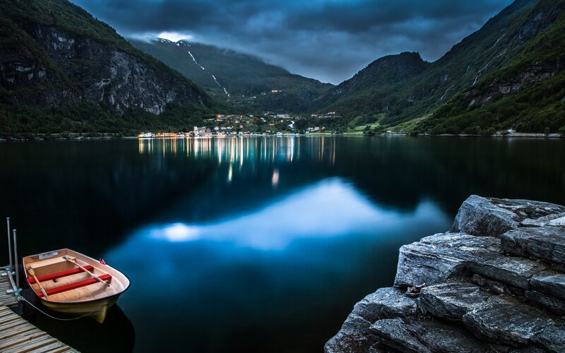 Boat on a fjord at dusk