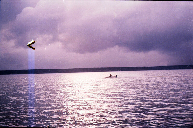 Boat on a lake under cloudy sky