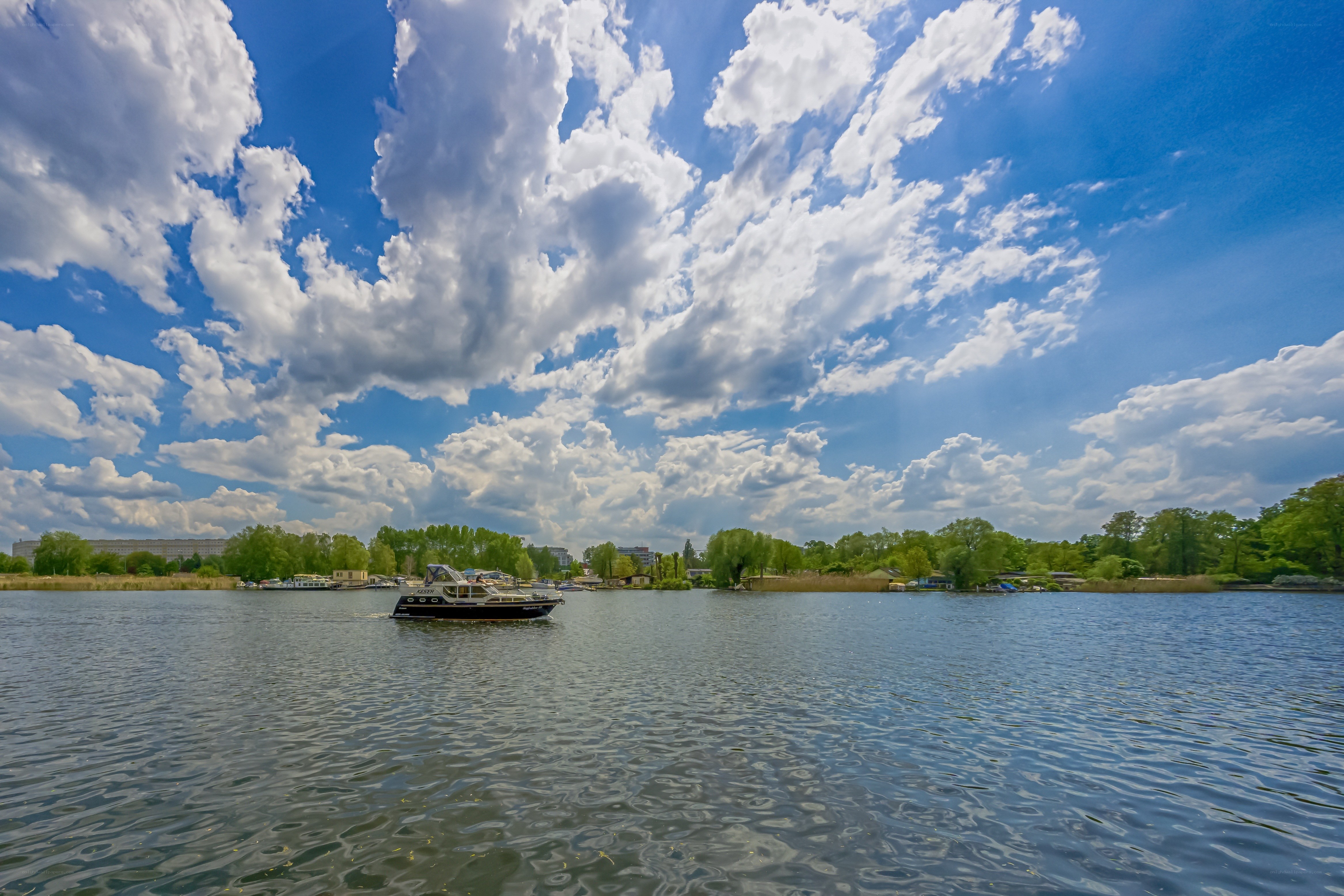 Boat on a lake under cloudy sky