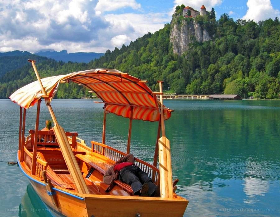 Boat on a lake with castle