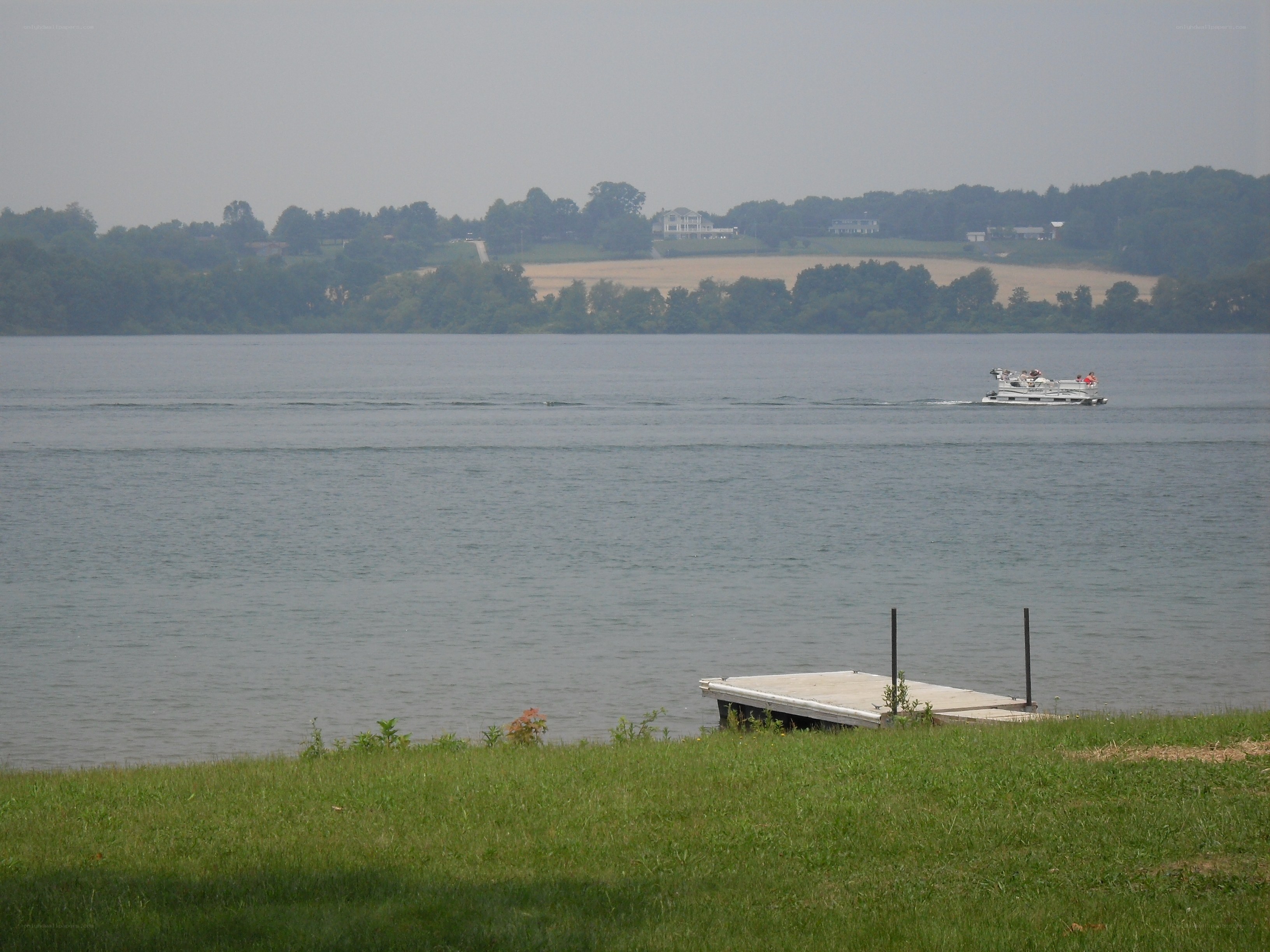 Boat on a lake with dock