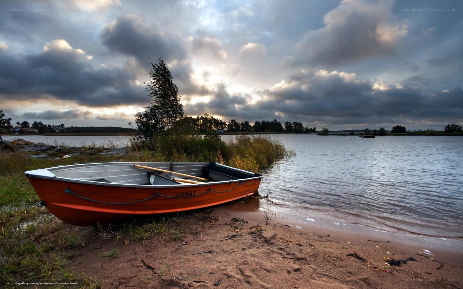 Boat on a lakeshore at dusk