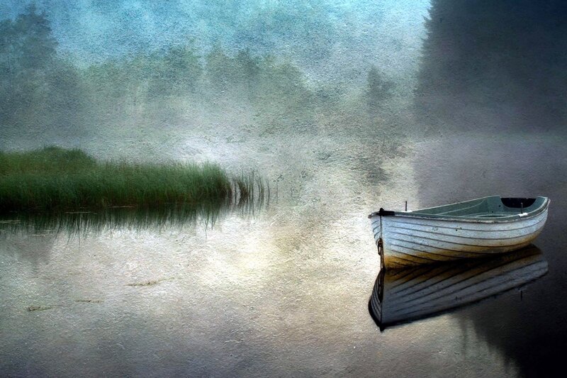 Boat on a misty lake