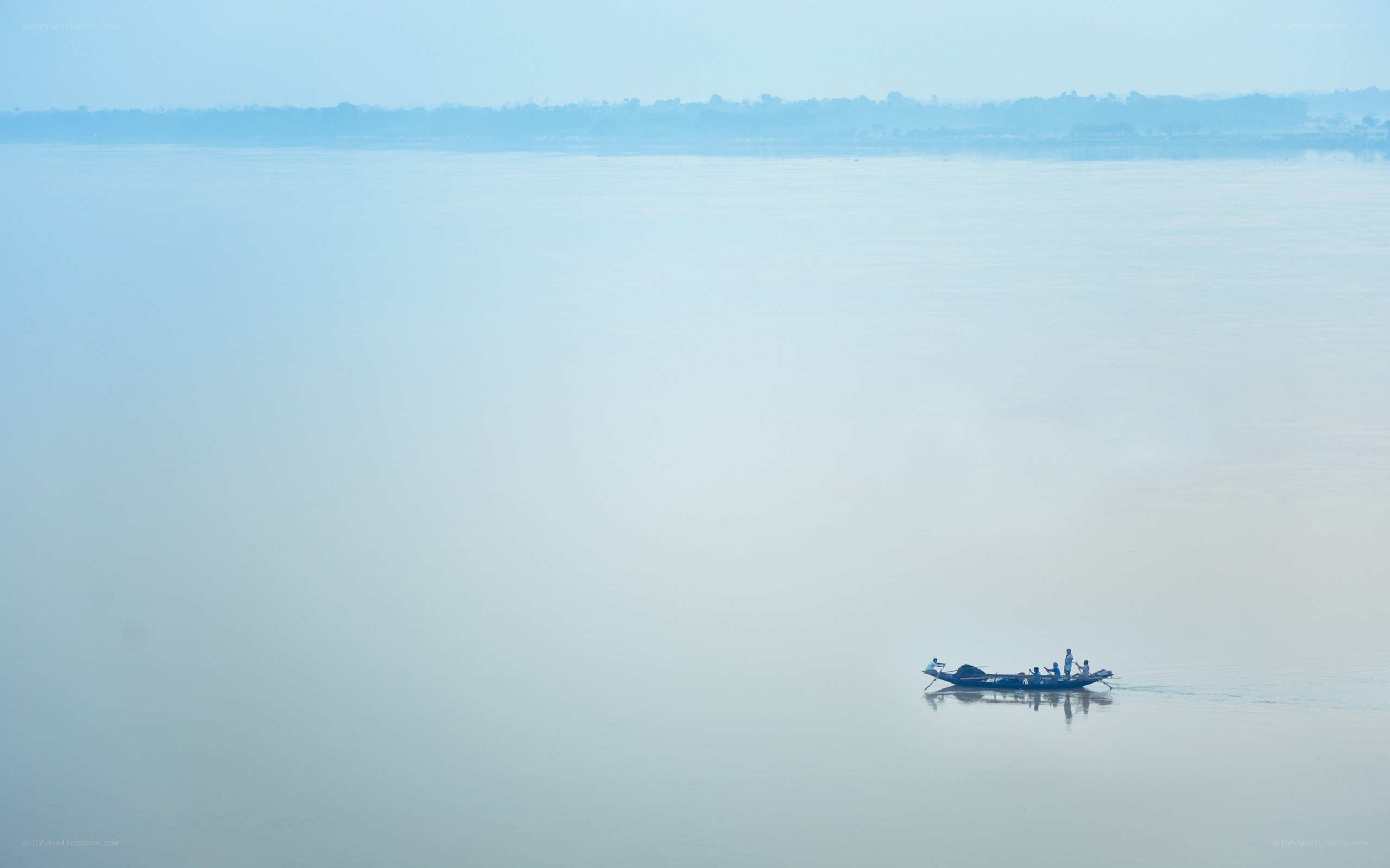 Boat on a misty river
