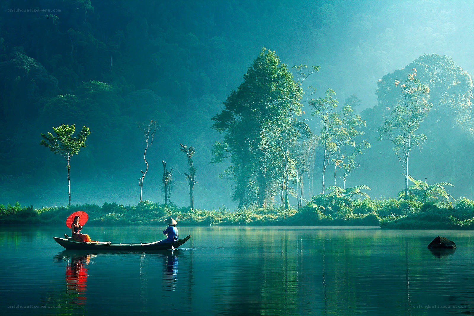 Boat on a misty river