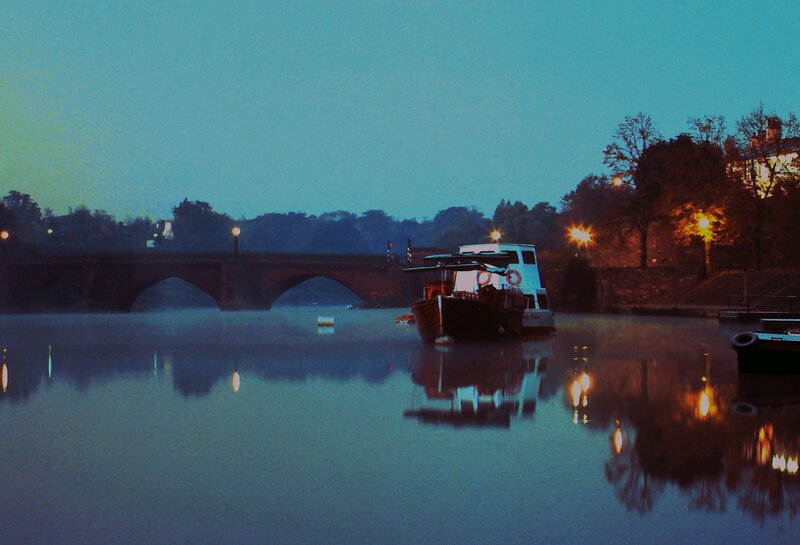 Boat on a river at dusk