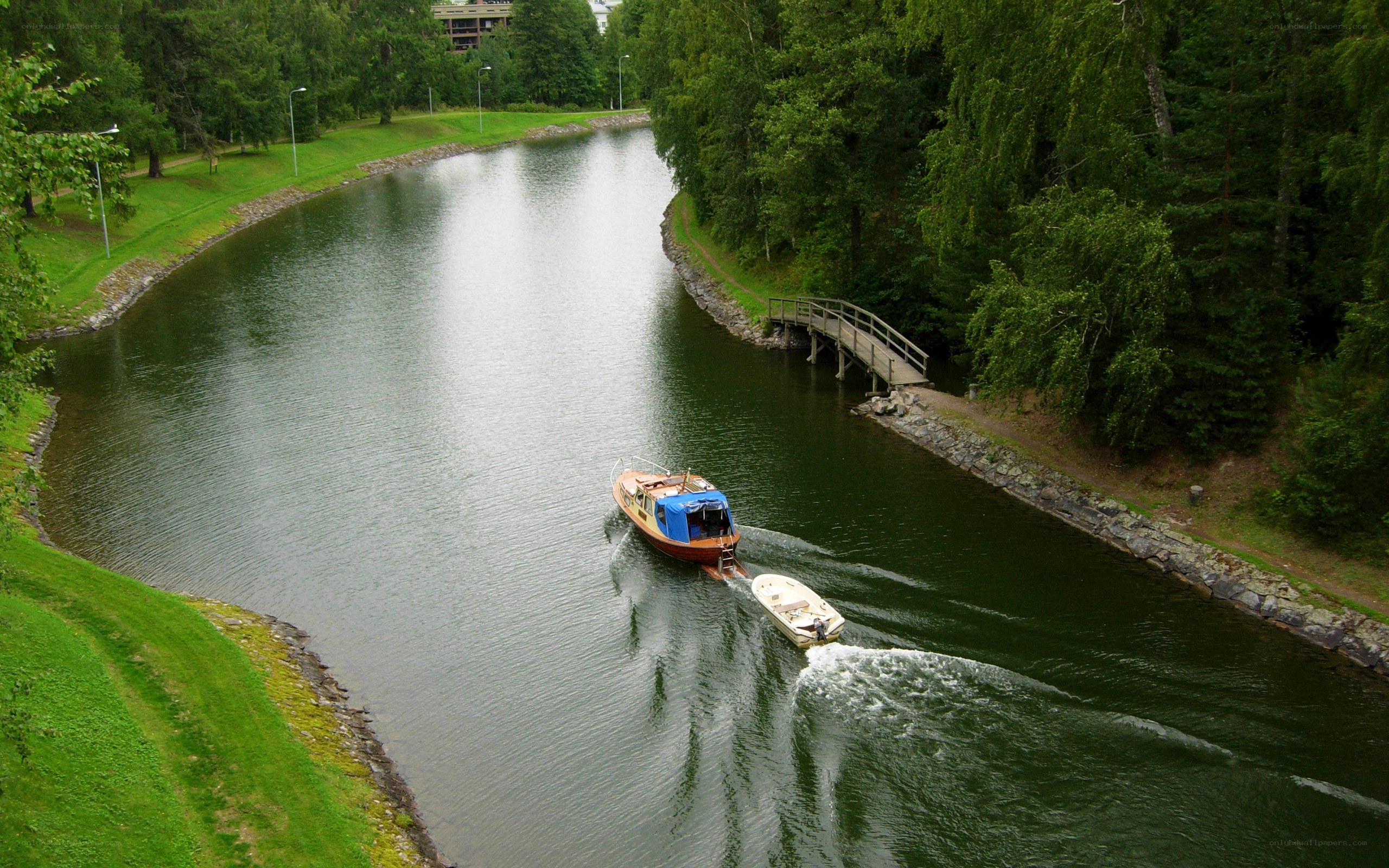 Boat on a river with bridge