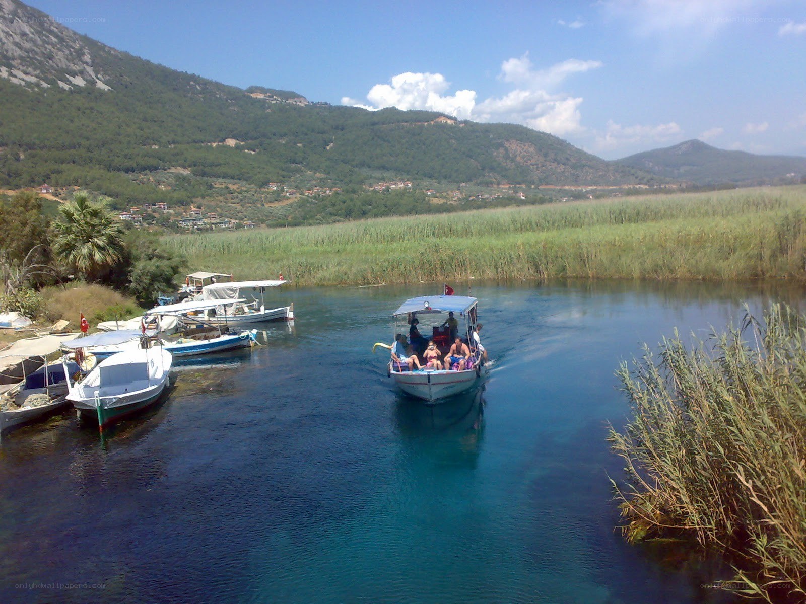 Boat on a river with mountains