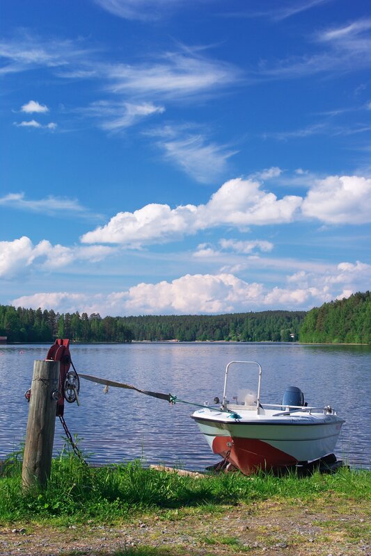 Boat on a sunny lakeside