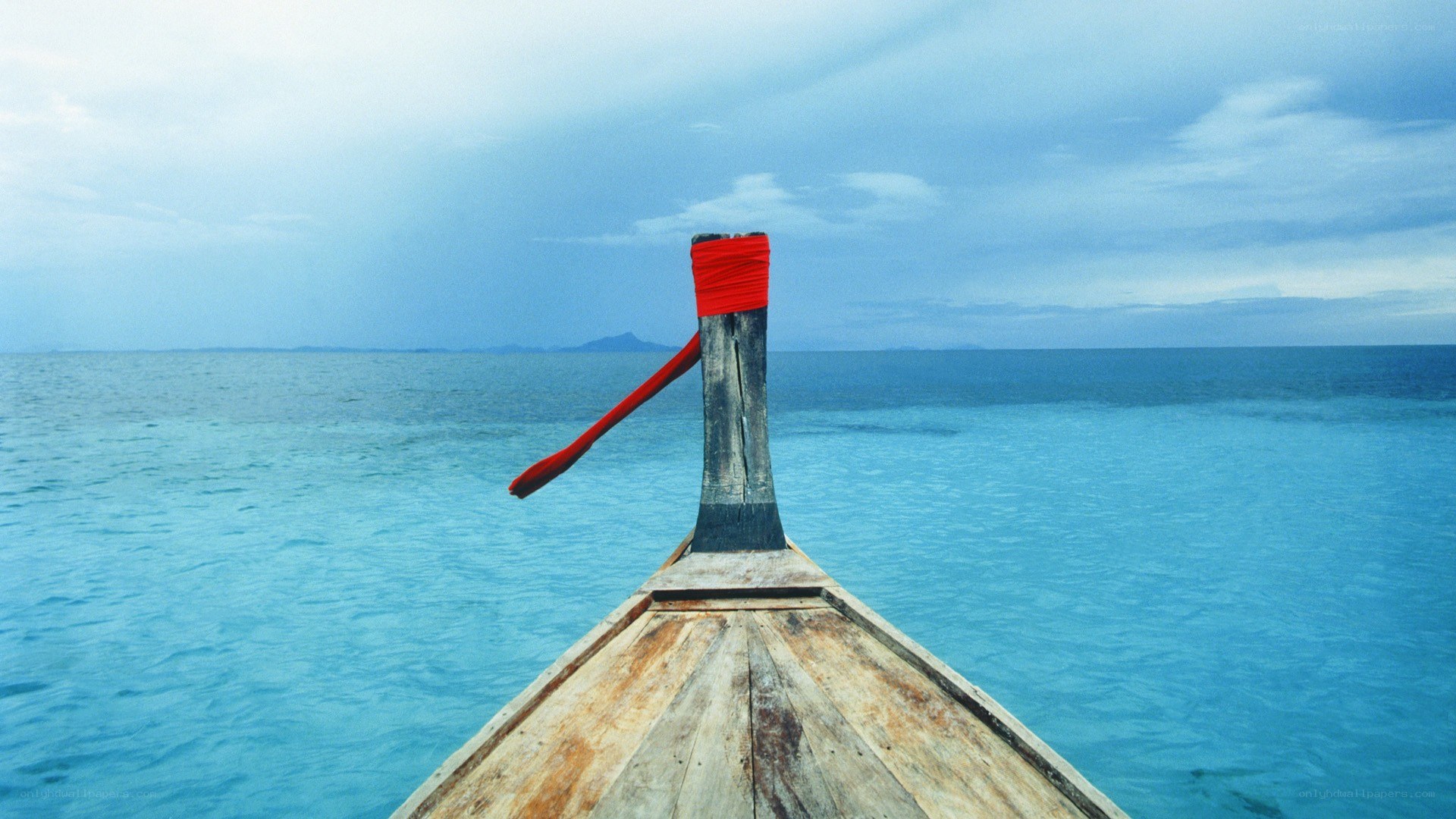 Boat on calm blue sea