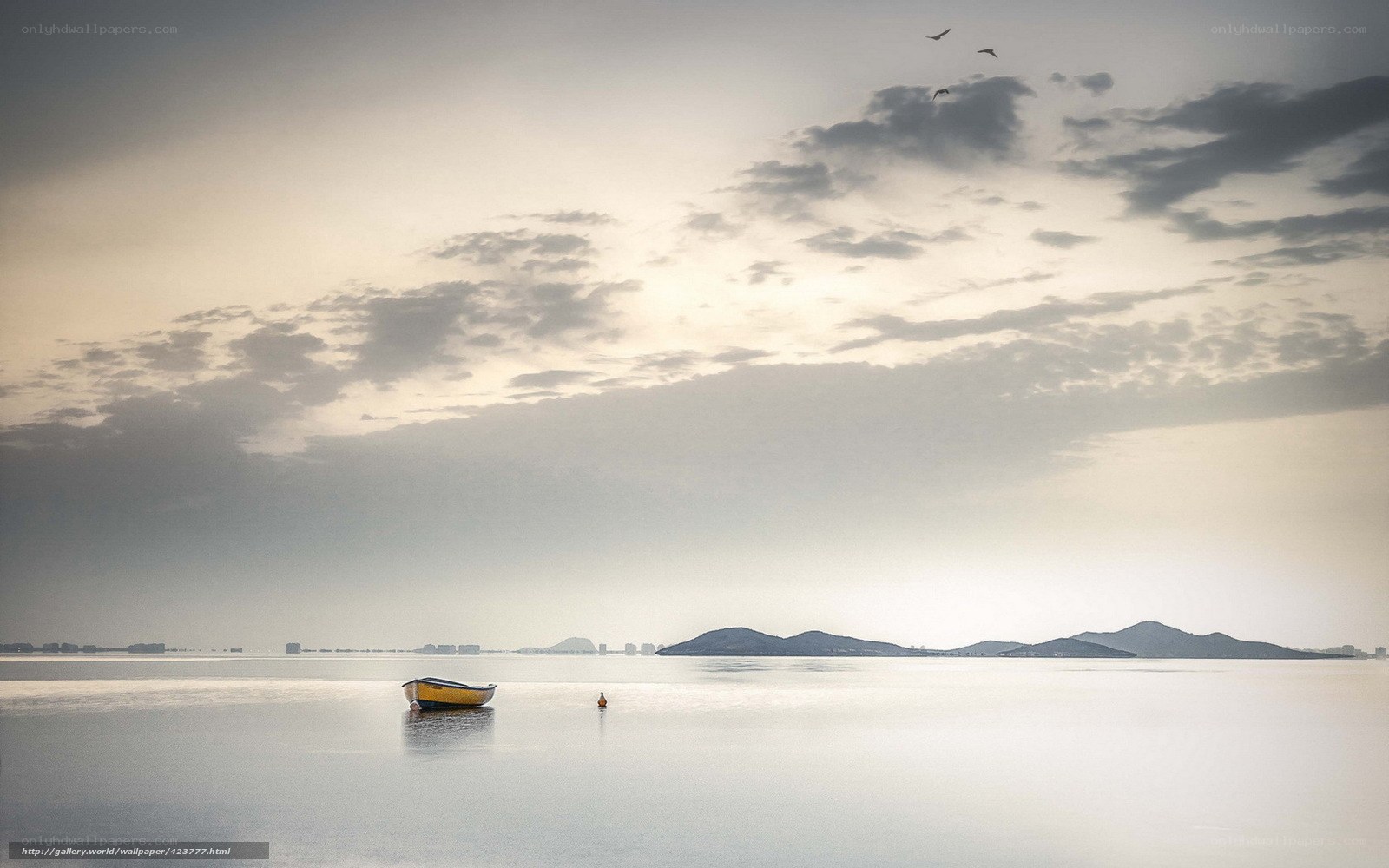Boat on calm sea at dawn
