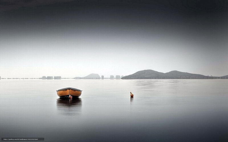Boat on calm water at dawn