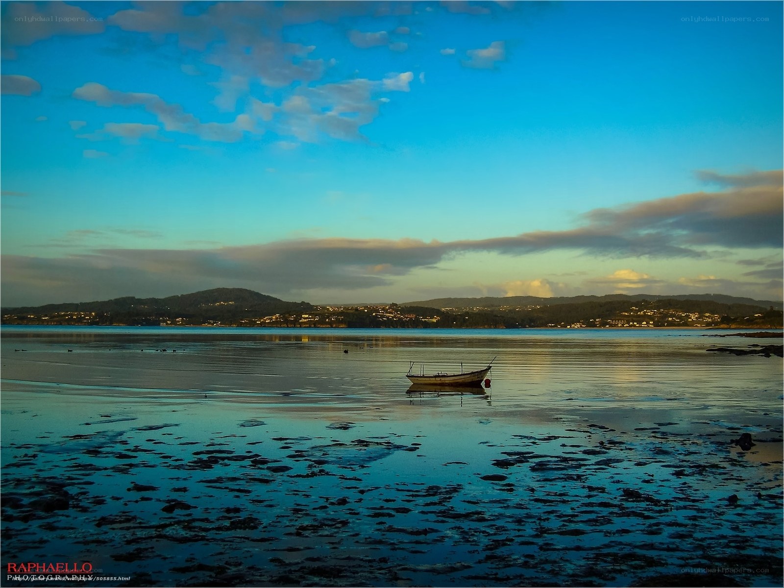 Boat on calm water at sunset