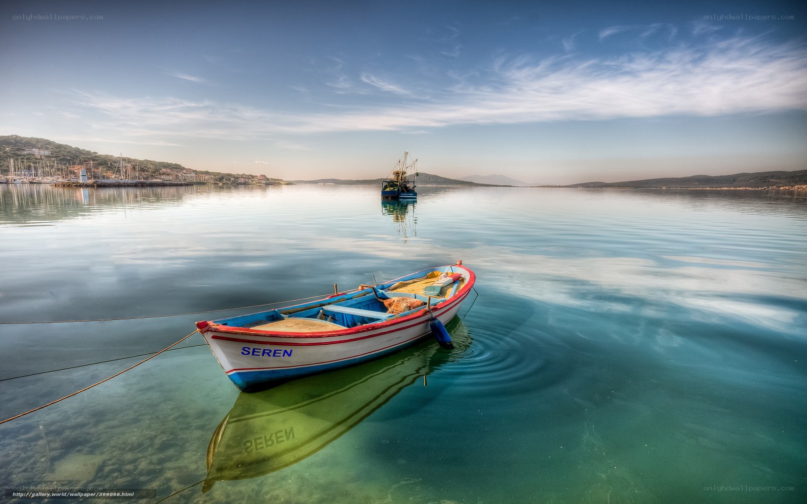 Boat on calm water at sunset