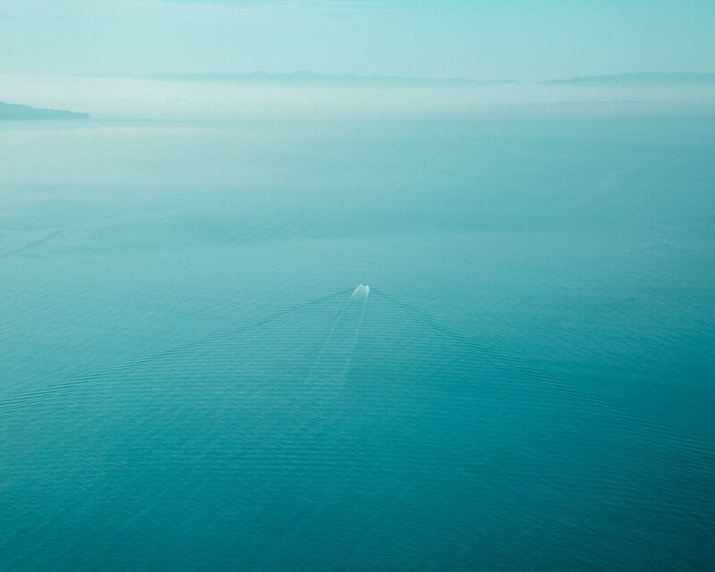 Boat on Calm Water — Blue, Serene, Morning, Photograph