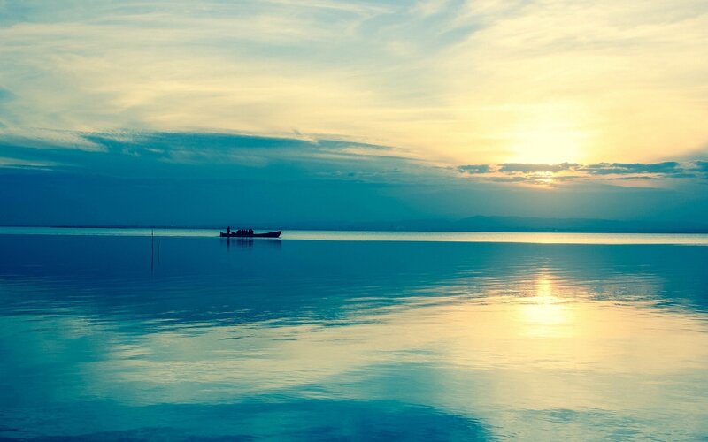 Boat on Calm Water — Blue, Serene, Sunset, Photograph, Sun