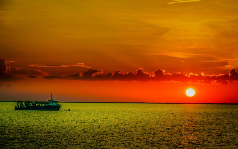 Boat on Calm Water — Orange, Dramatic, Sunset