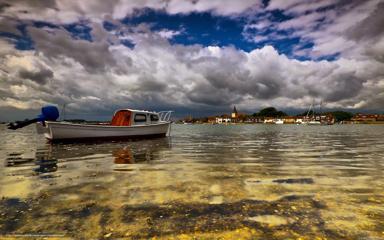 Boat on calm water under cloudy sky