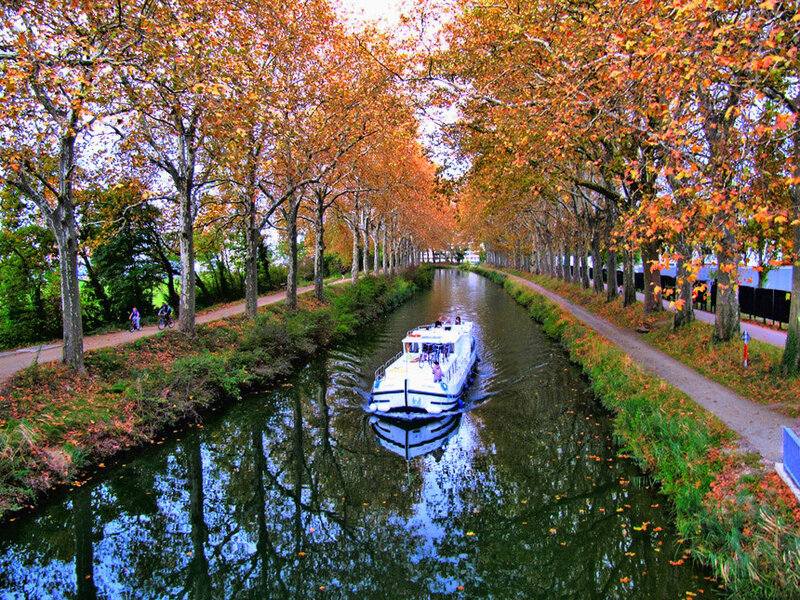 Boat on canal in autumn