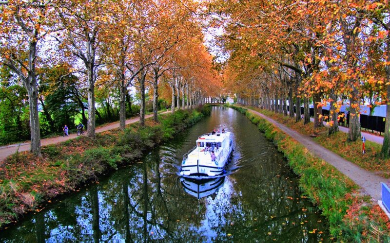 Boat on canal in autumn