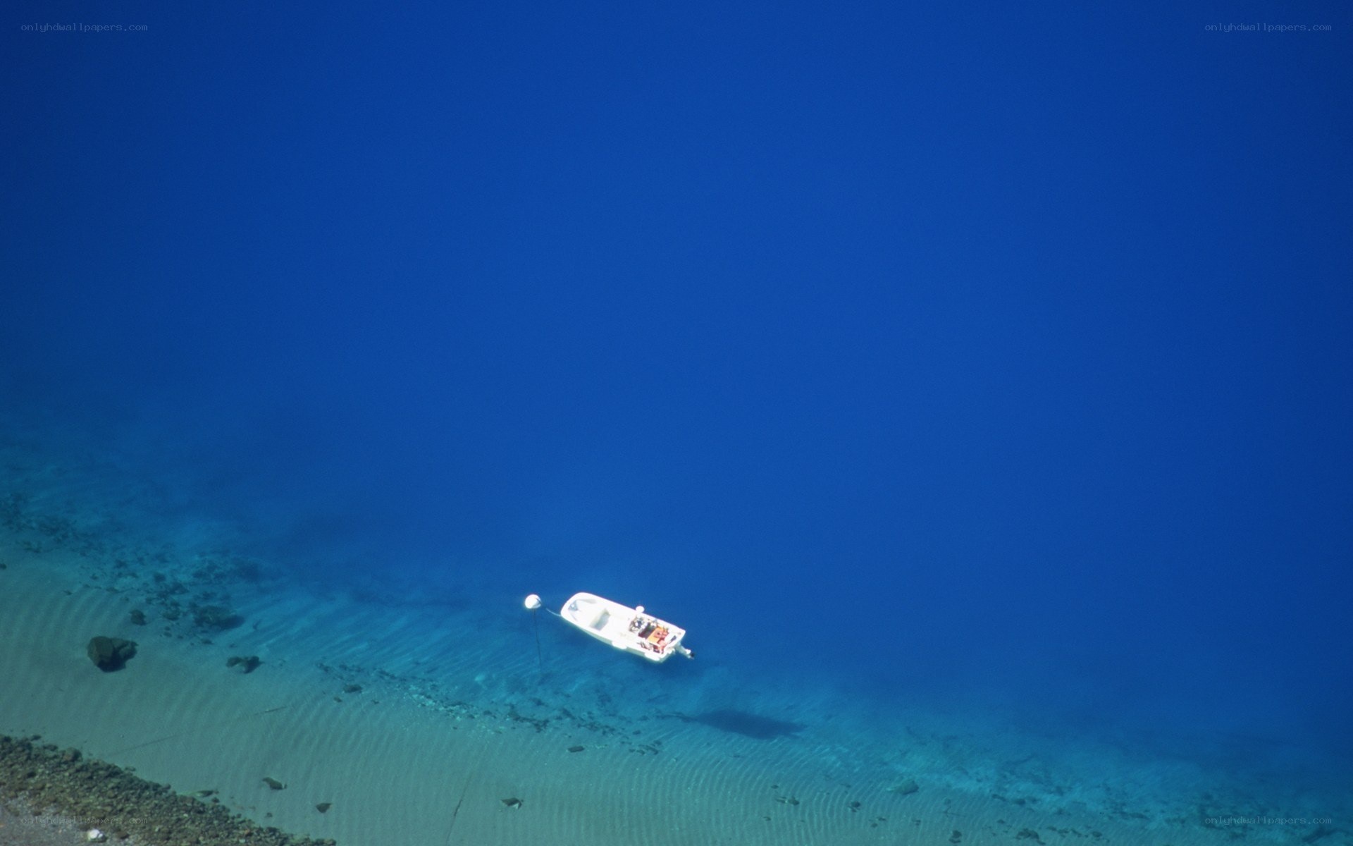 Boat on clear blue water