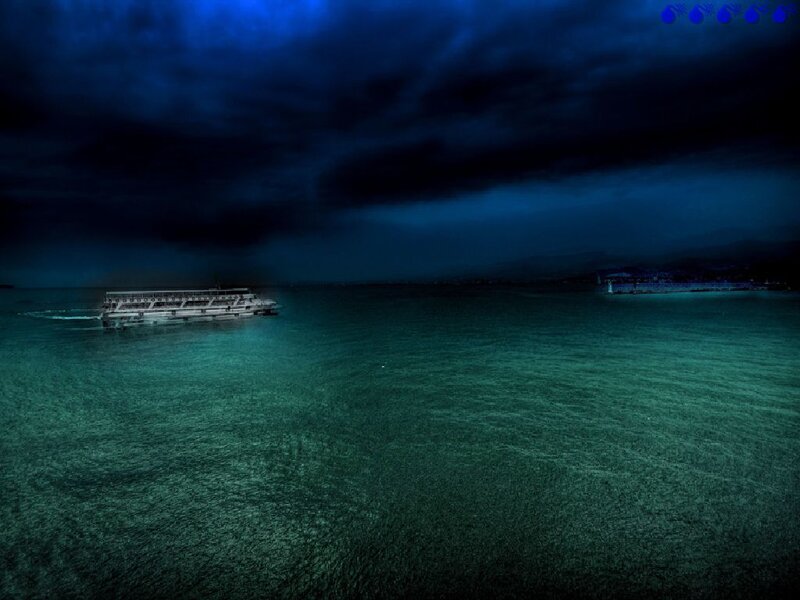 Boat on dark sea at night