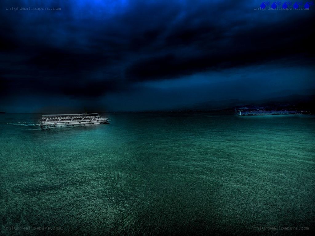 Boat on dark sea at night