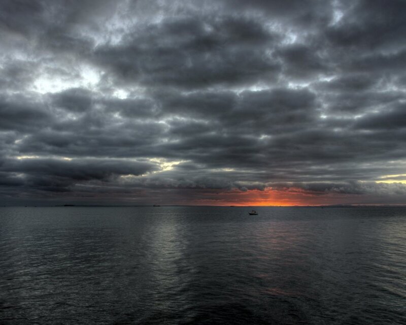 Boat on Dark Water — Gray, Dramatic, Sunset, Photograph, Clouds, Ocean