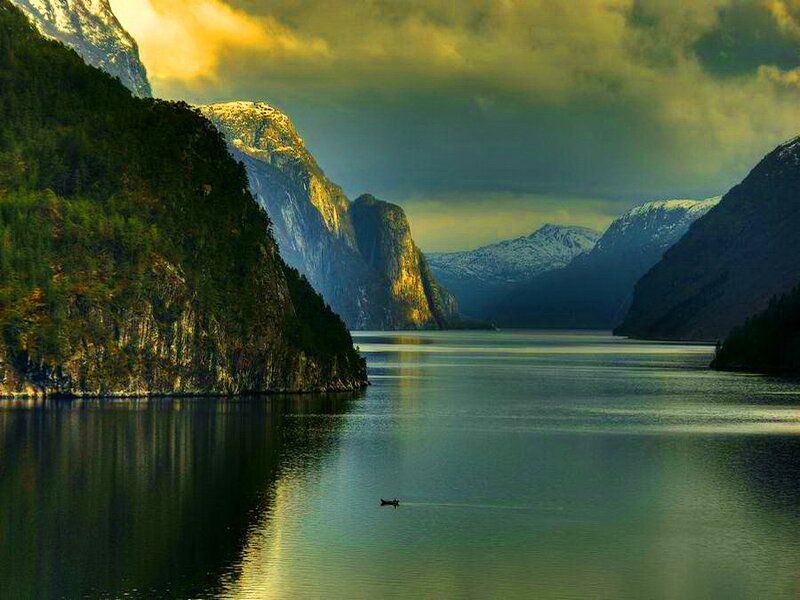 Boat on Fjord at Sunset