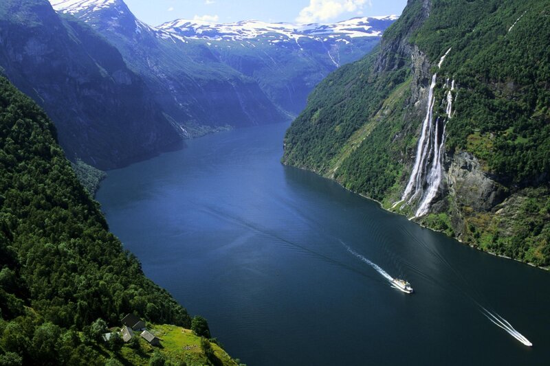 Boat on Fjord with Waterfall