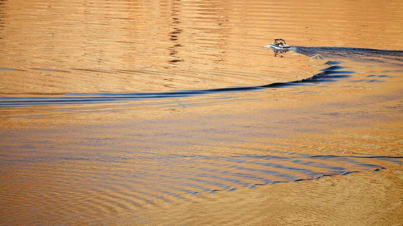 Boat on golden water