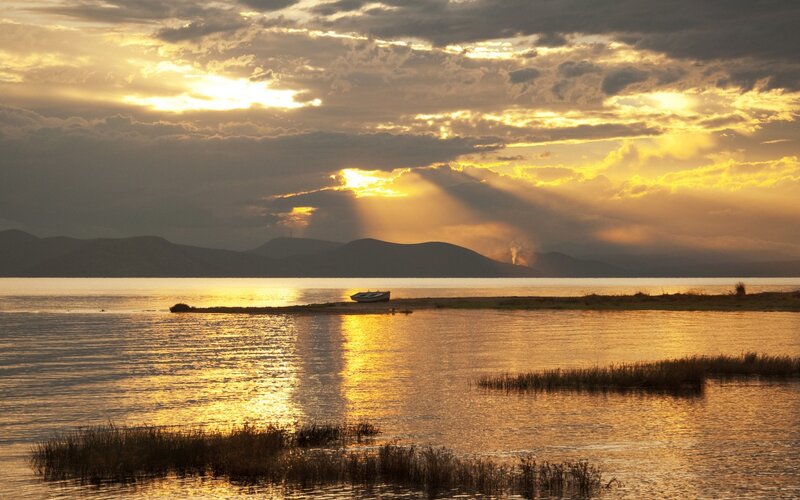 Boat on Lake at Sunset — Gold, Dramatic