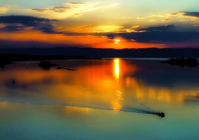 Boat on Lake at Sunset — Orange, Serene
