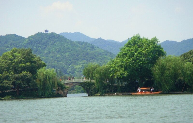 Boat on Lake with Bridge